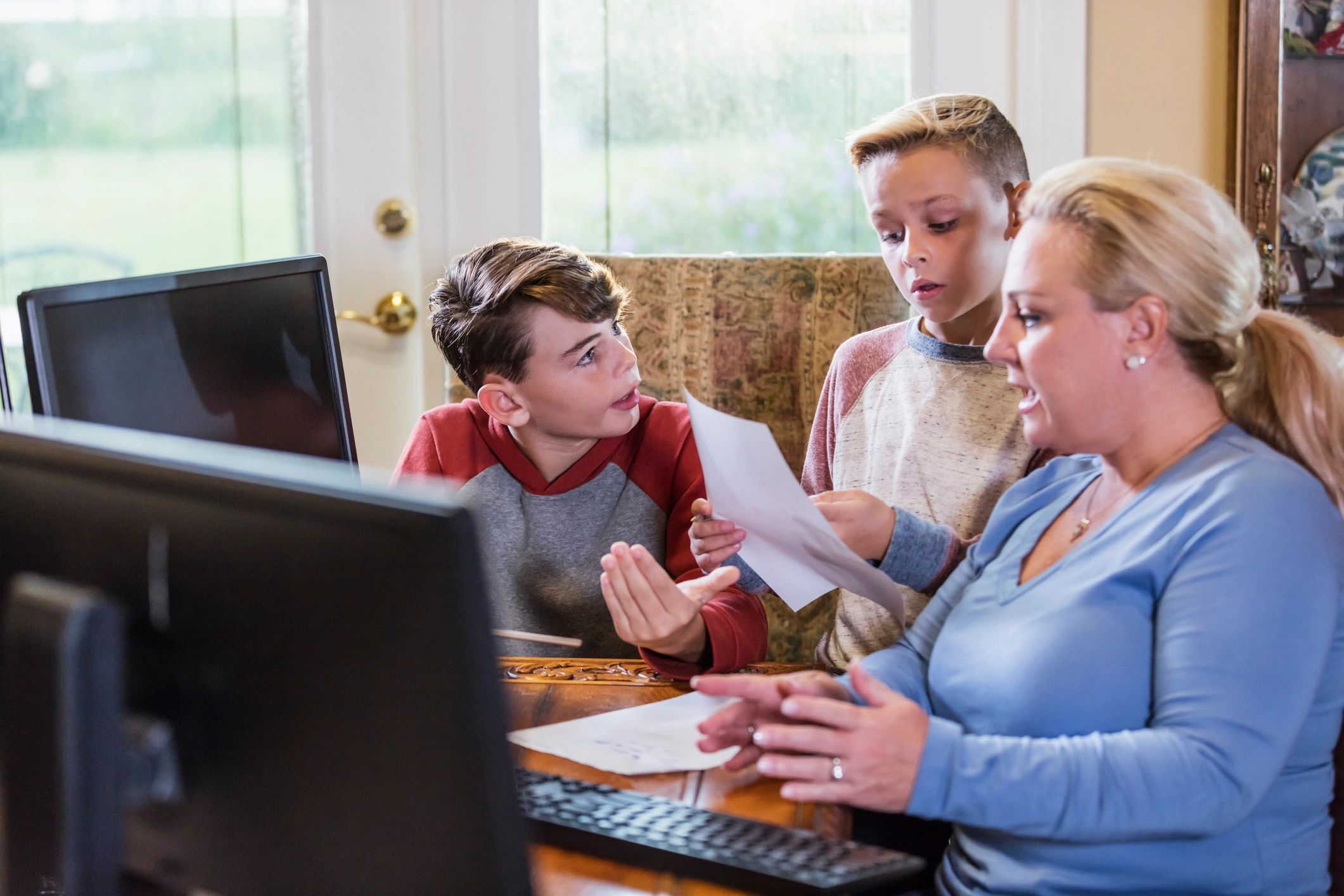 Parent helping children with learning at home