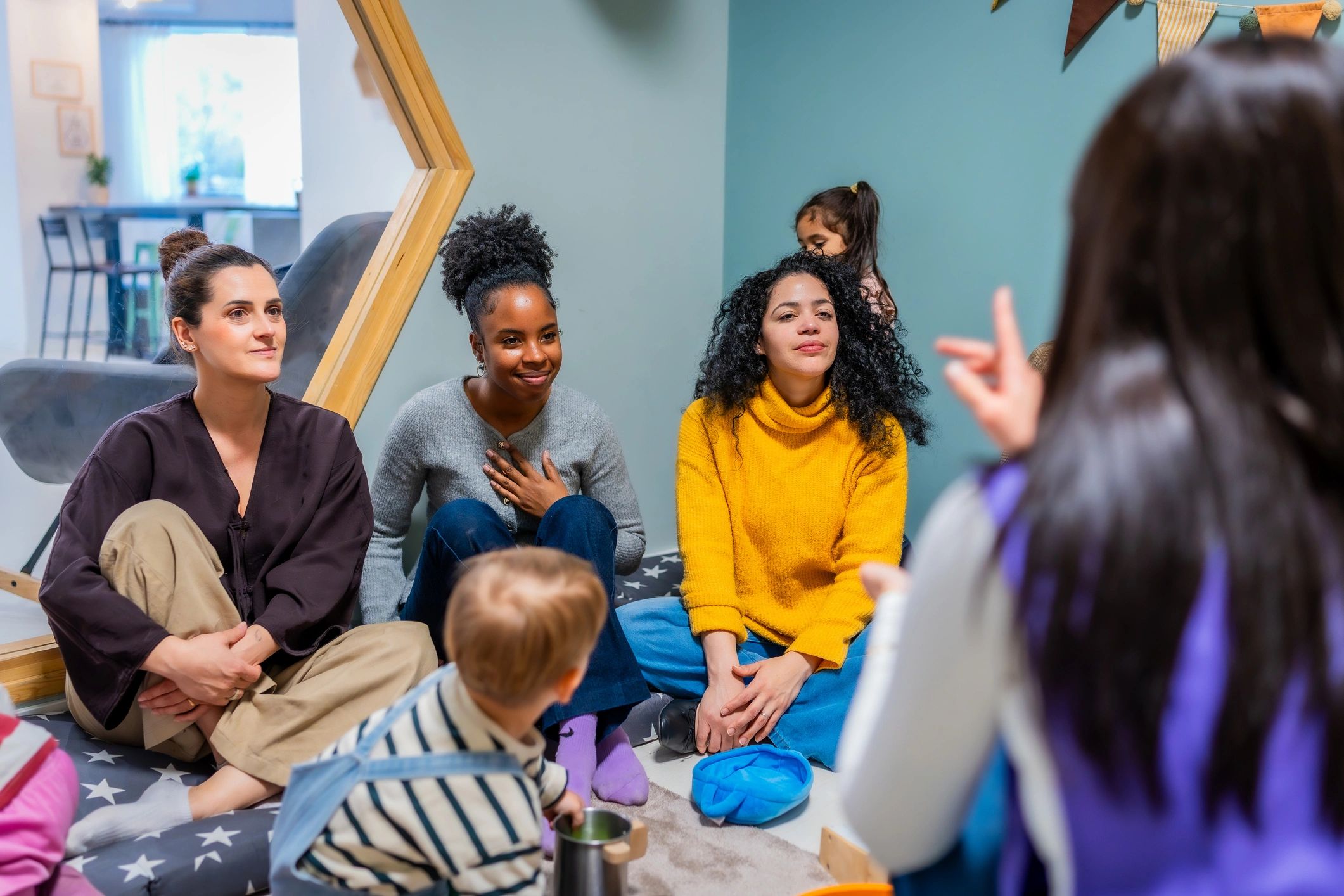 Parents and educator participating in a learning session